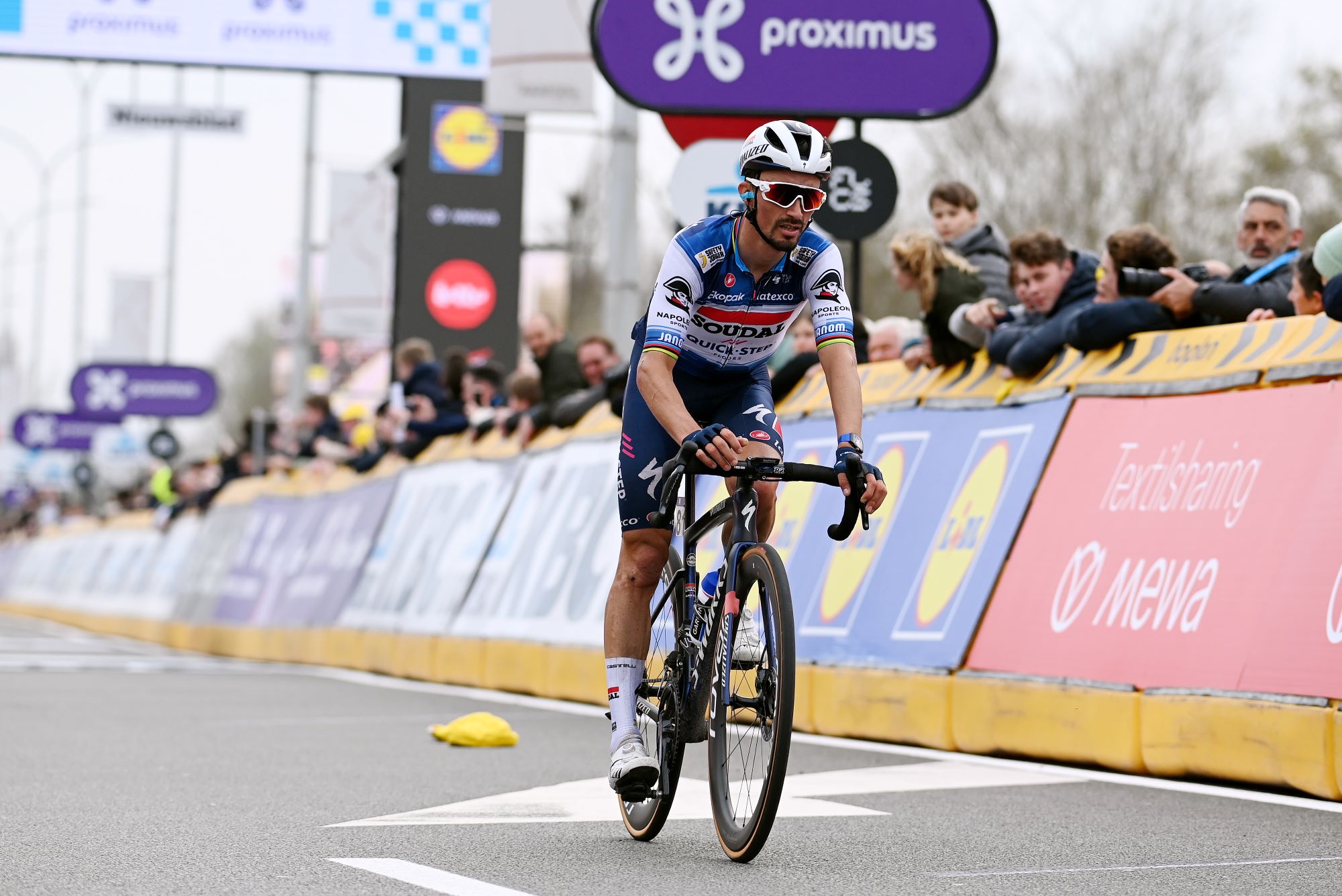 Julian Alaphilippe crosses the line at Dwars door Vlaanderen